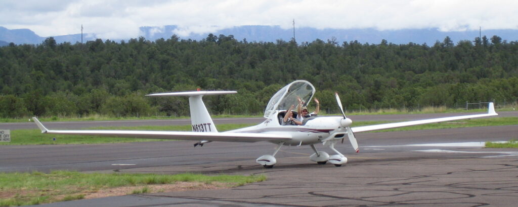 happy guys in motor glider at Payson airport