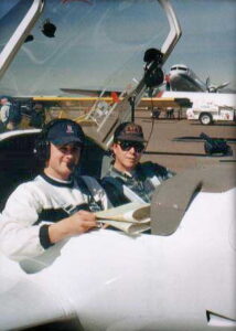 two young gentlemen is a motor glider cockpit